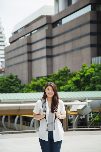 Beautiful Asian woman holding laptop