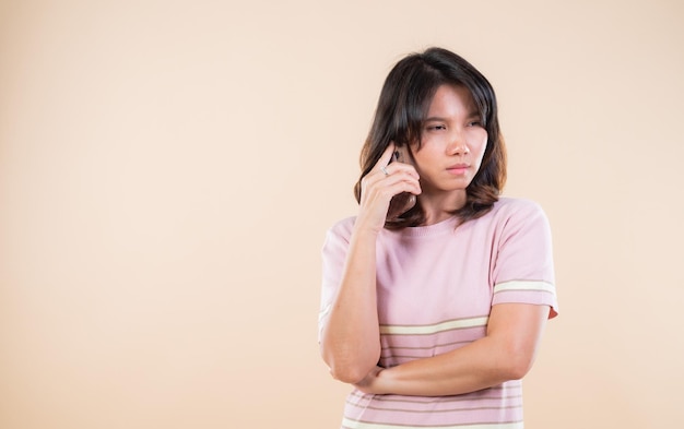 Beautiful asian woman pretty girl calling a mobile phone