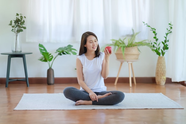 Beautiful asian woman staying fit by exercising at home for healthy trend lifestyle