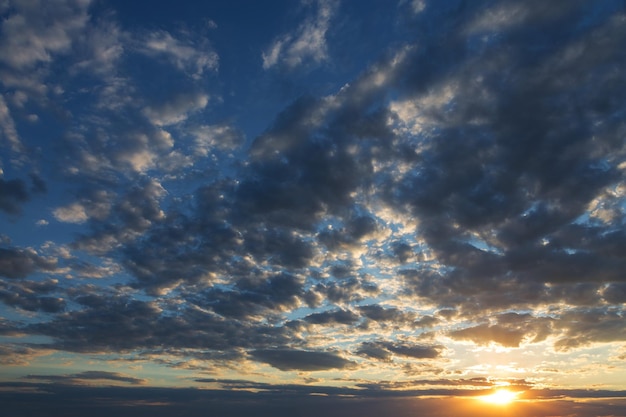 Beautiful atmospheric dramatic clouds in the evening at sunset