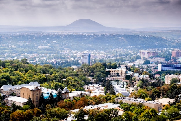 Beautiful autumn landscape view of the city and mountains.