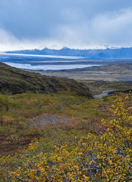 Beautiful autumn view from Mulagljufur Canyon to Fjallsarlon glacier with Breidarlon ice lagoon Iceland Not far from Ring Road and at the south end of Vatnajokull icecap and Oraefajokull volcano