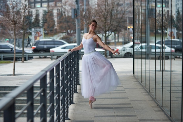 Beautiful ballerina dancing in the city.