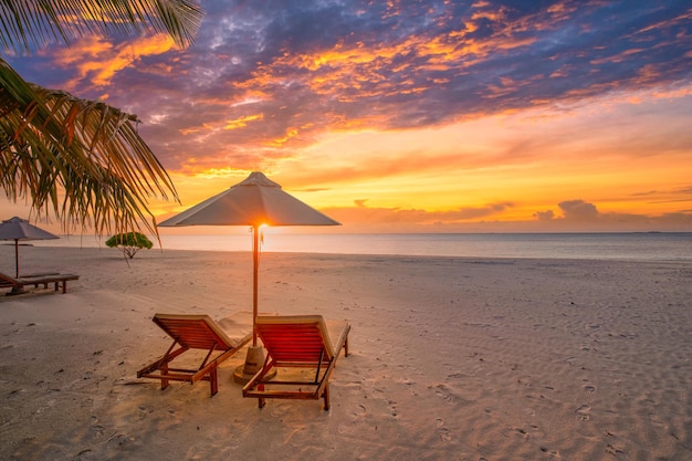 Beautiful beach. Chairs on the sandy beach near the sea. Summer holiday and vacation tourism concept