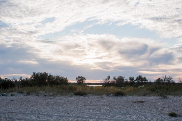 Beautiful beach on the lake at sunset