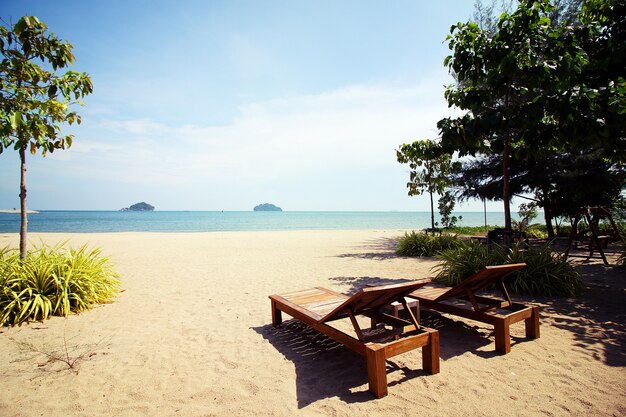 Beautiful beach scene. Chairs on the sandy beach near the sea in Summer holiday