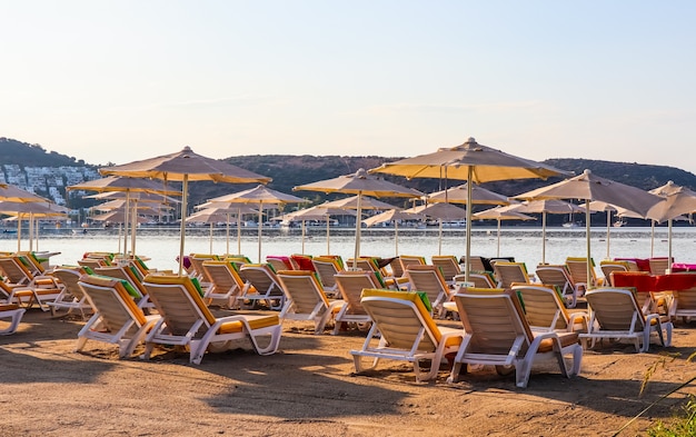 Beautiful beach on the shores of the calm blue bay of the aegean sea in the early morning beach