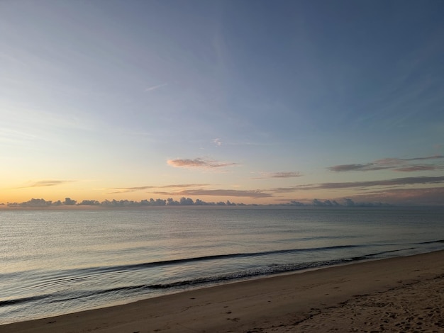 Beautiful the beach with clouds in the sky before sunrise in the morning time