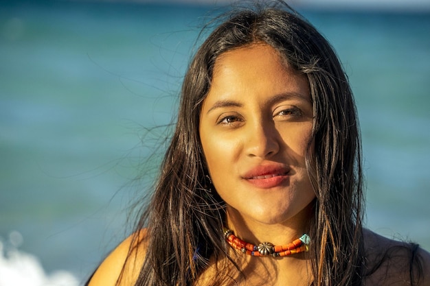 Beautiful black hair girl mexican latina portrait on baja california beach