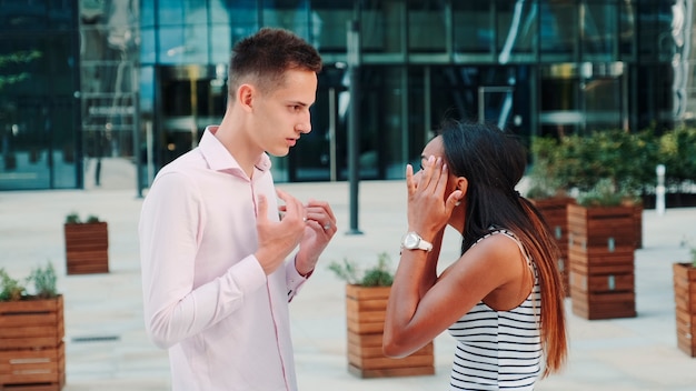 Photo beautiful black woman accusing her husband of treason outdoors