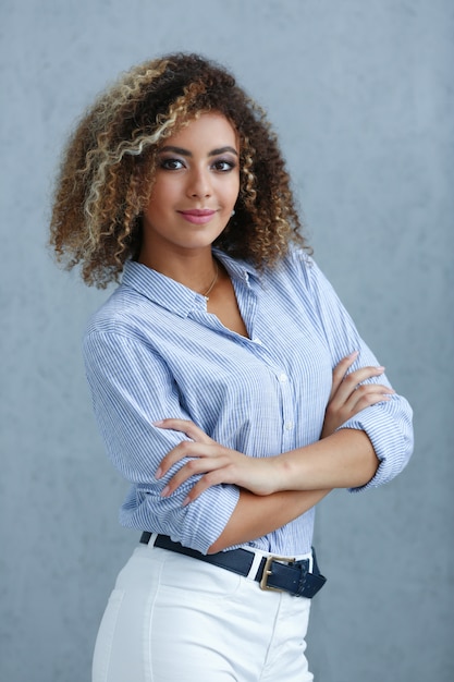 Beautiful black woman portrait. smiling beauty fashion style curly