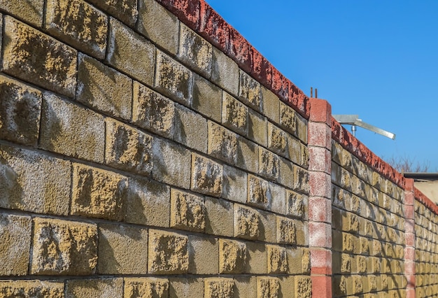 Beautiful blank cinder block fence against the sky