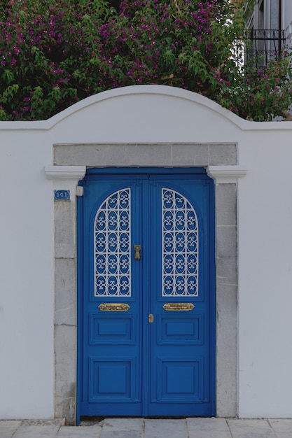 Beautiful blue door in a white wall in the style of european resorts bodurm turkey