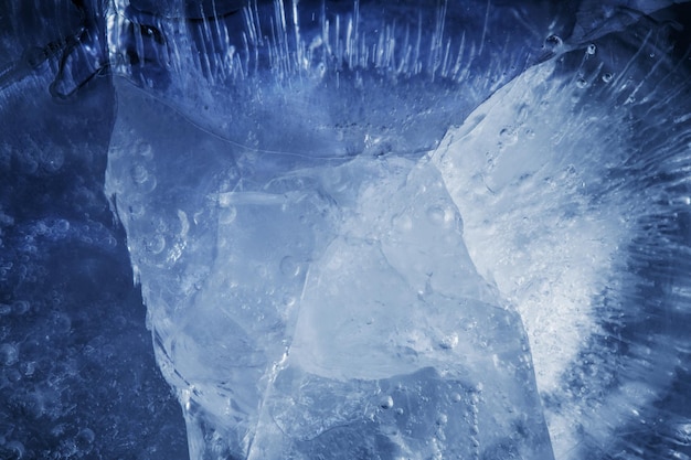 Beautiful blue ice with cracks. frosty background