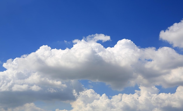 Beautiful blue sky with white fluffy cloud background