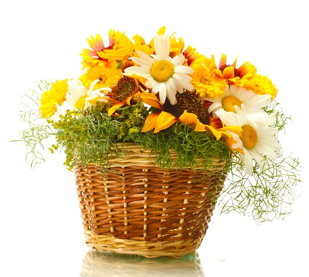 Beautiful bouquet of bright wildflowers in basket isolated on white