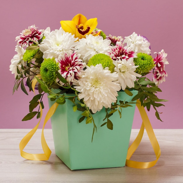 Beautiful bouquet of various flowers in flowerpot.