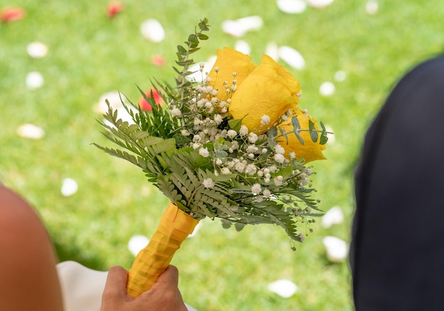 Beautiful branch of yellow roses for wedding celebration