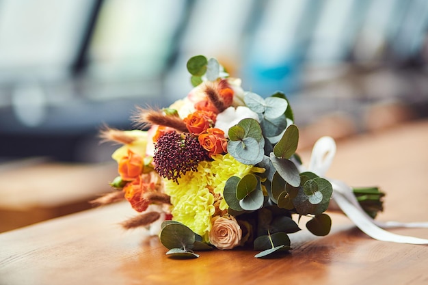 Beautiful bridal wedding bouquet lying on the table