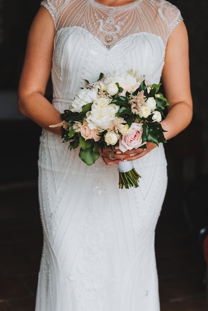 Beautiful bride holding her wedding bouquet