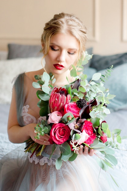 Beautiful bride holding wedding bouquet