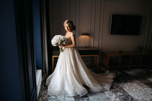 beautiful bride in the hotel with the bride's bouquet