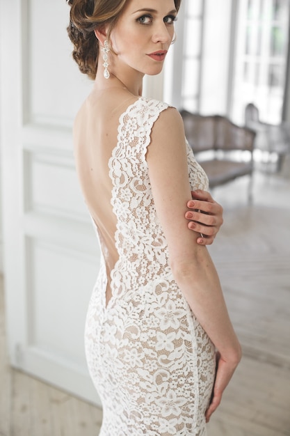 Beautiful bride posing in a wedding dress