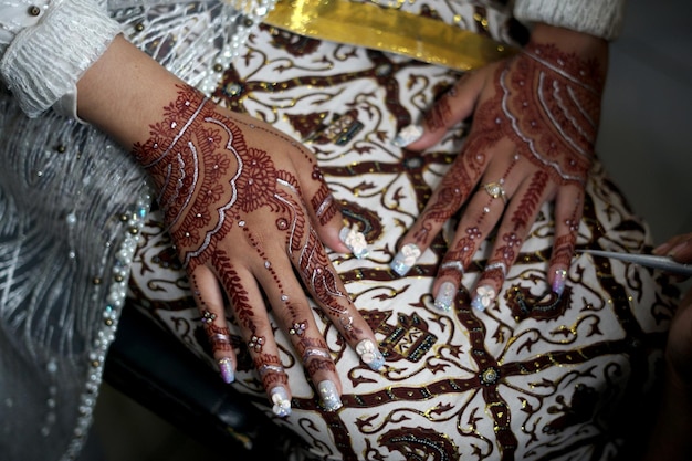 Beautiful Bride Showing Henna on her Hands a Traditional Wedding Ceremony in Indonesia