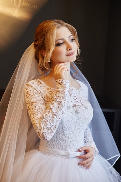 Beautiful bride in white wedding dress on wedding day.