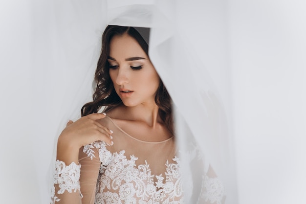 Beautiful bride with fashion wedding hairstyle - on white background.