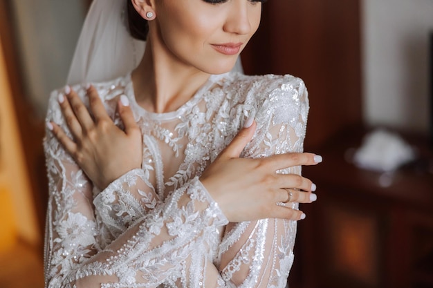 Beautiful bride with a fashionable wedding hairstyle wedding nude makeup Close up portrait