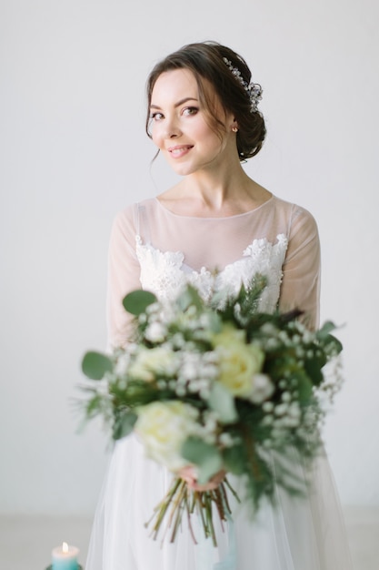 Beautiful bride with wedding bouquet