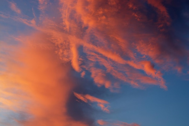 Beautiful bright orange clouds in a blue skysummer sunset