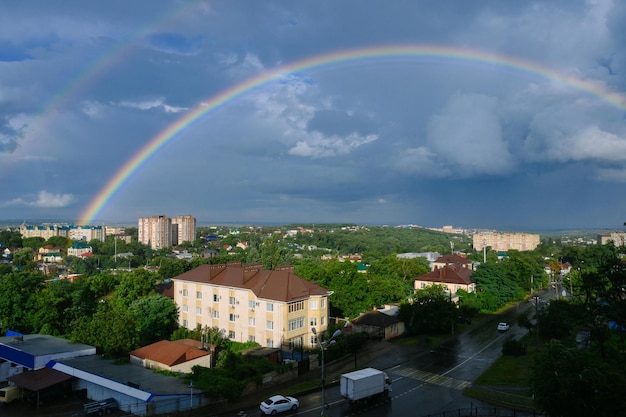 beautiful bright rainbow over the city. High quality photo