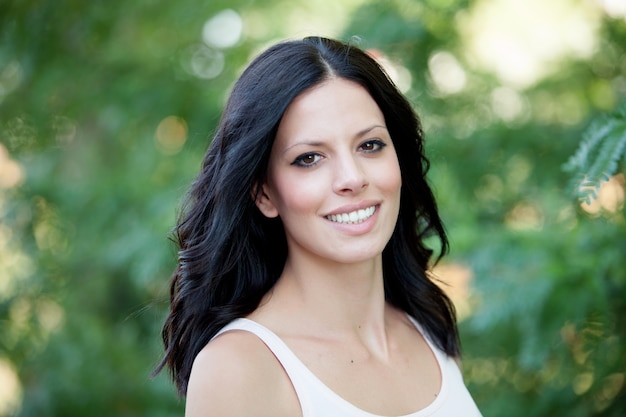 Beautiful brunette girl relaxing in the park  