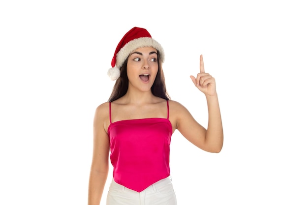 Beautiful brunette girl in santa claus hat isolated on white background with copy space