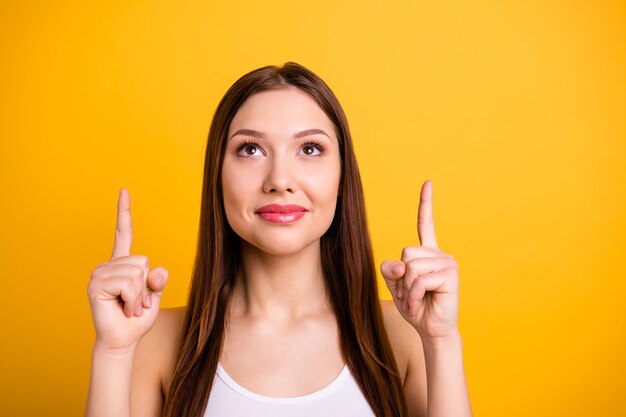 beautiful brunette posing isolated on orange