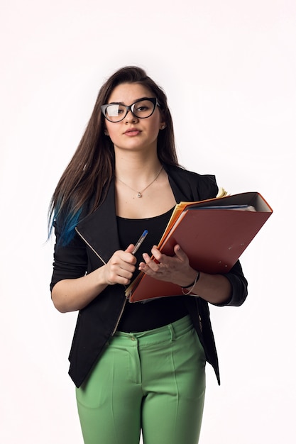 Beautiful brunette student girl in black jacket with papers