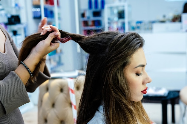 Beautiful brunette woman in a beauty salon