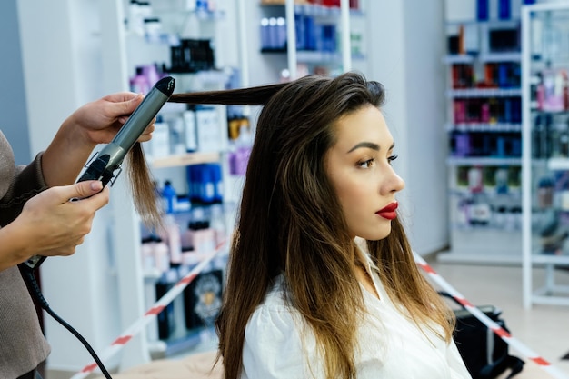 Beautiful brunette woman in a beauty salon