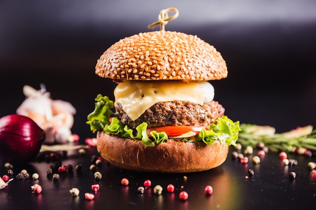 Beautiful burger on dark surface