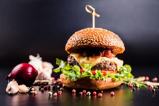 Beautiful burger on dark surface