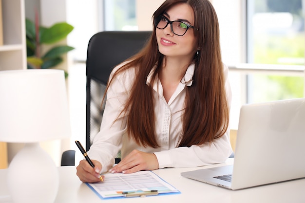 Beautiful business woman busy in the office