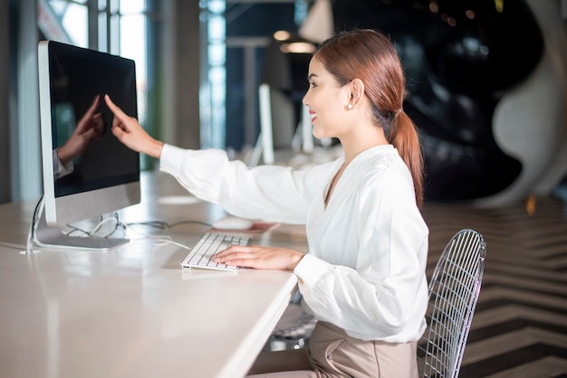 Beautiful business woman is working with her computer 