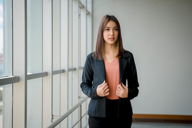 Beautiful business woman standing at the window