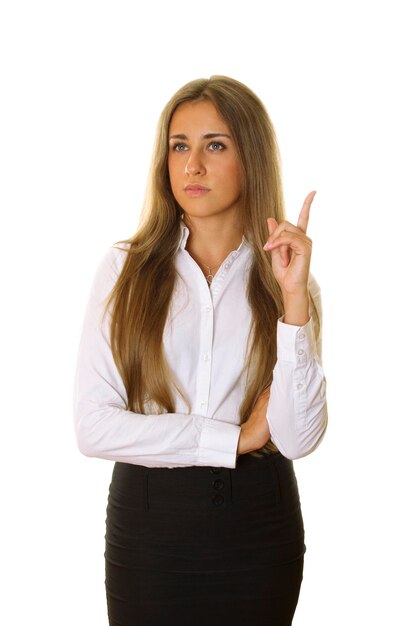 Beautiful businesswoman pointing at copyspace