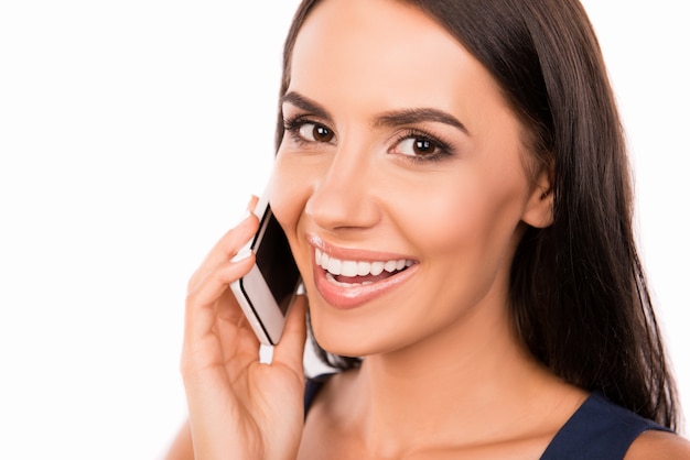 Beautiful businesswoman talking on the phone and smiling