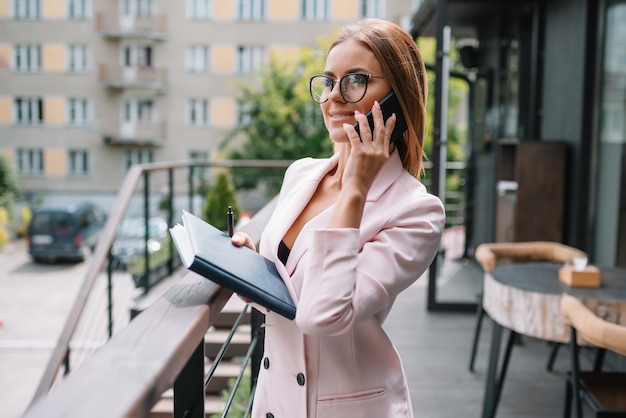 Beautiful businesswoman using the phone