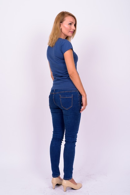 beautiful businesswoman with blond hair wearing blue shirt against white space