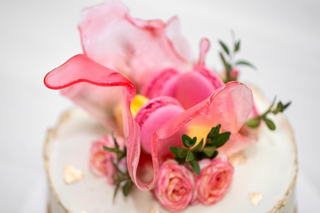 Beautiful cake with strawberries and macaroons